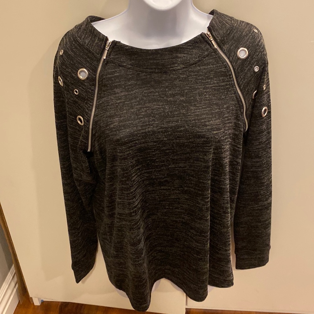 L black great spandex sweater with grommets on each side as well as zippers